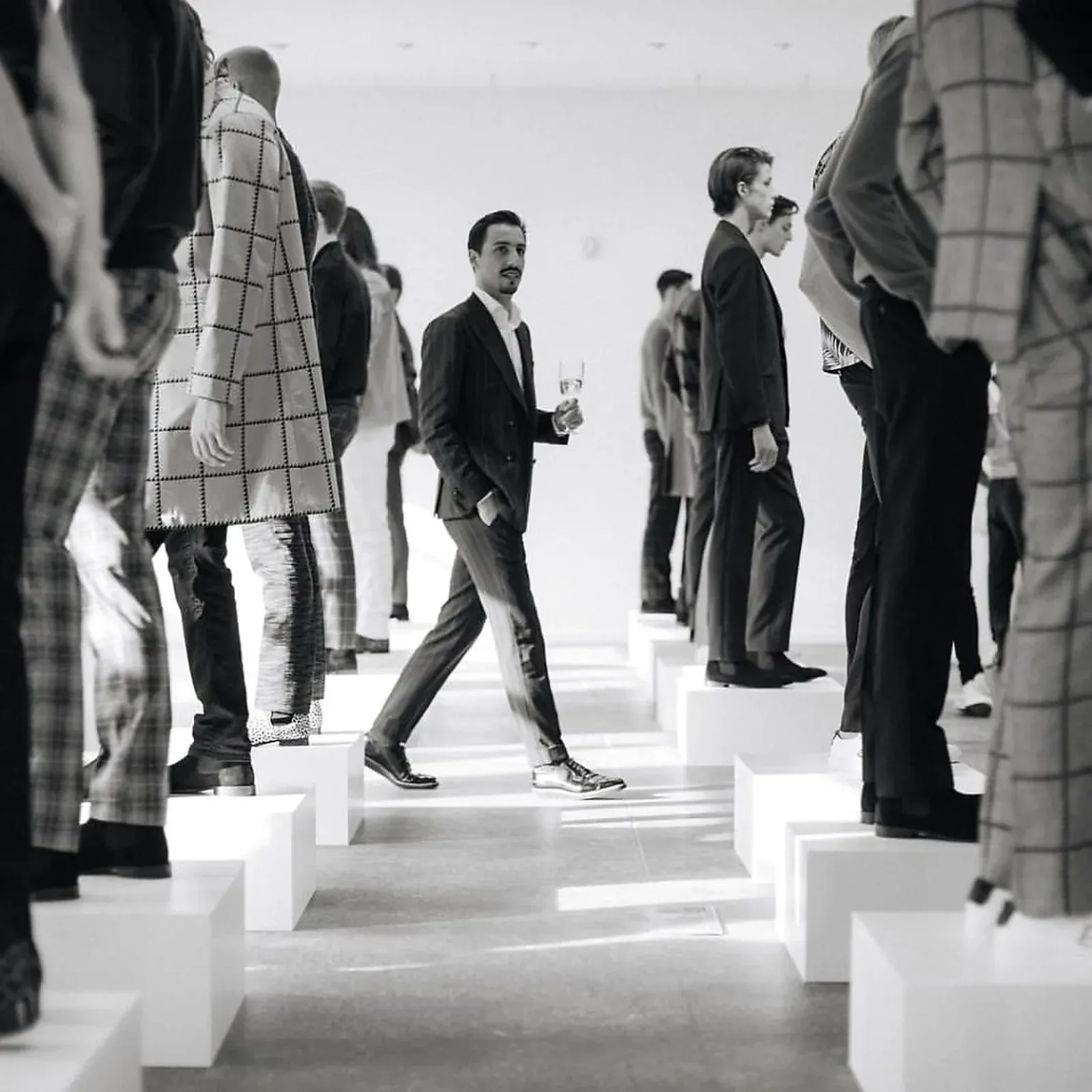 Custom white pedestals built for a men's fashion show in NYC